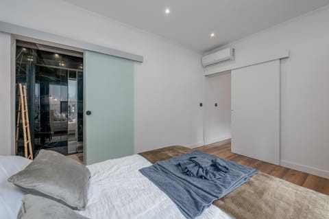 Bed, Photo of the whole room, Bedroom, towels, air conditioner