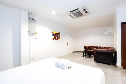 Bed, Photo of the whole room, Bedroom, towels, air conditioner