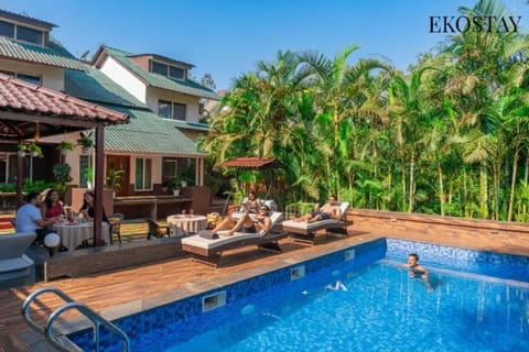 Property building, Patio, Day, People, Natural landscape, Garden, Evening entertainment, Garden view, Pool view, Swimming pool, group of guests, sunbed
