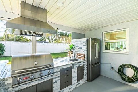 Heated PoolFire PitOutdoor KitchenCorn Hole House in Palm Beach Gardens