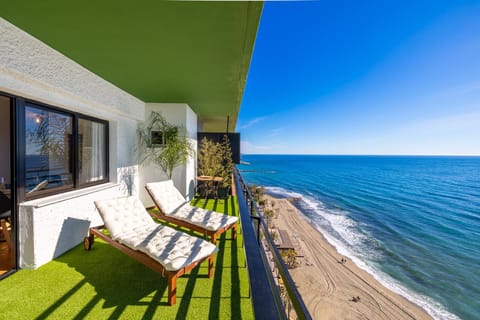 View (from property/room), Balcony/Terrace, Seating area, Beach, Sea view, sunbed