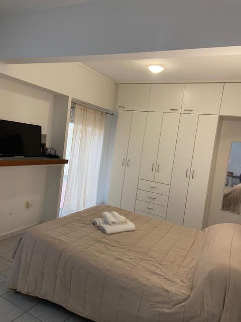 Bed, towels, wardrobe