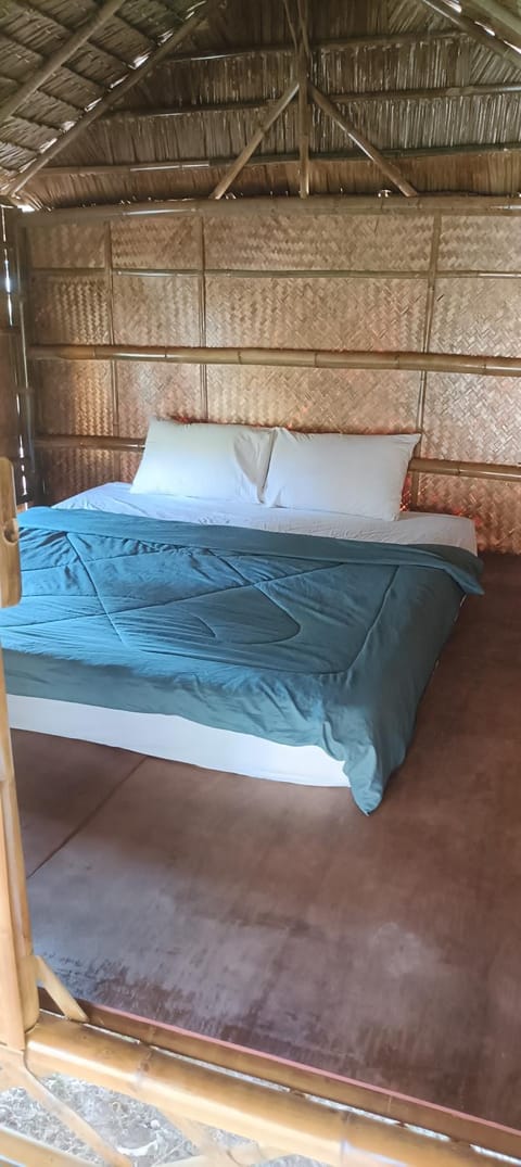 in the palm hut Campground/
RV Resort in Sala Dan