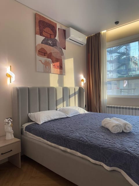 Bed, Photo of the whole room, Bedroom, towels, air conditioner