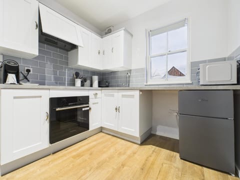 Kitchen or kitchenette, oven, stove, toaster