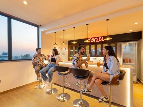 Property building, People, Lounge or bar, Seating area, group of guests