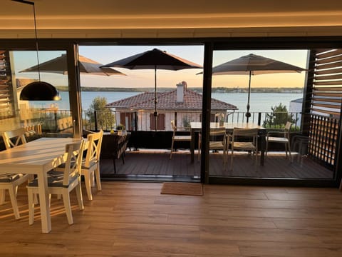 Day, Natural landscape, View (from property/room), Balcony/Terrace, Living room, Dining area, Lake view, Sea view