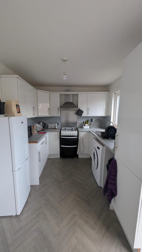 Kitchen or kitchenette, dishwasher, oven, stove, toaster