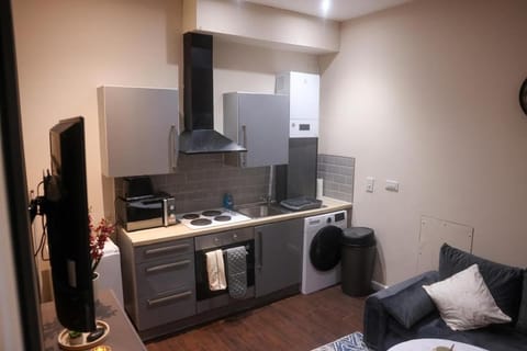 Kitchen or kitchenette, Living room, Seating area, oven, stove, toaster, washing machine