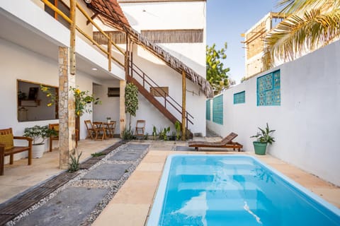 Property building, Patio, Day, View (from property/room), Pool view, Swimming pool, sunbed