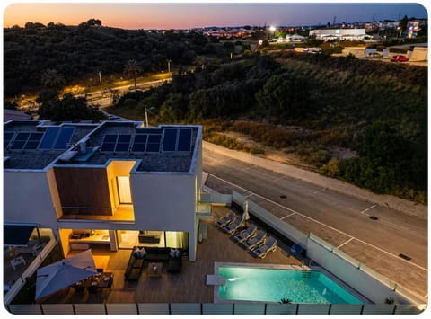 Property building, Night, Neighbourhood, Natural landscape, Street view, Swimming pool, Sunset, Parking