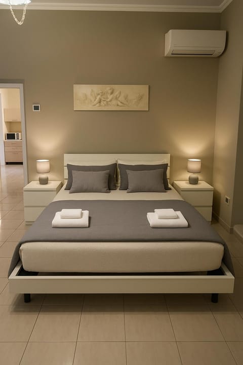 Bed, Photo of the whole room, Bedroom, towels, air conditioner