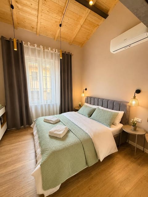 Bed, Photo of the whole room, Bedroom, towels, air conditioner
