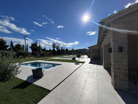 Property building, Day, Natural landscape, Pool view, Swimming pool, sunbed