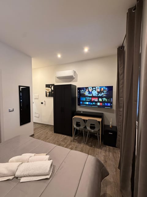 TV and multimedia, Photo of the whole room, Seating area, Bedroom, towels, wardrobe, air conditioner