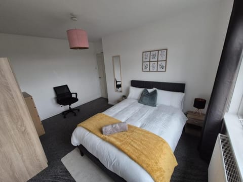 Bed, towels, wardrobe