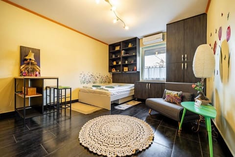 Bed, Living room, Seating area, Bedroom