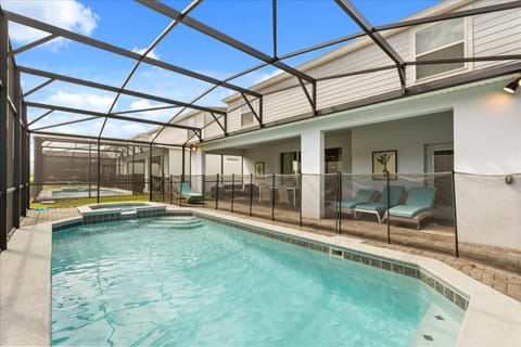Property building, Patio, Day, Natural landscape, Pool view, Swimming pool, sunbed