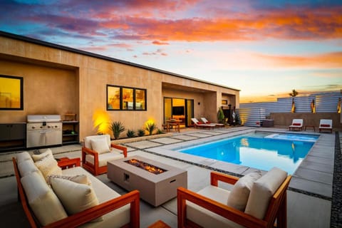 Property building, Patio, Natural landscape, Seating area, Pool view, Swimming pool, Sunset, fireplace, sunbed