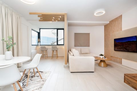 Property building, Living room, Seating area, City view, Lake view, Street view