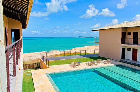 Property building, Patio, Day, Natural landscape, View (from property/room), Balcony/Terrace, Beach, Pool view, Sea view, Swimming pool, sunbed