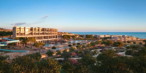 Property building, Day, Natural landscape, Garden, Aqua park, Sea view, Area and facilities, Swimming pool, Sunset