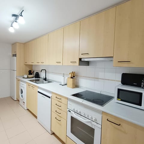 Kitchen or kitchenette, dishwasher, oven, stove, toaster