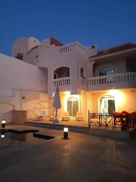 Property building, Patio, Night, View (from property/room), Balcony/Terrace, Pool view, Swimming pool