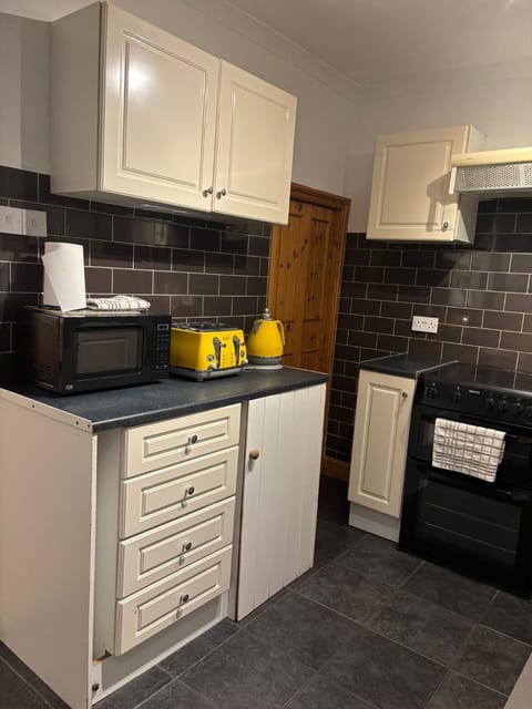 Kitchen or kitchenette, oven, stove, toaster