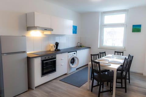 Kitchen or kitchenette, Dining area, dishwasher, stove, washing machine