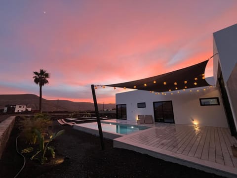 Property building, View (from property/room), Mountain view, Swimming pool, Sunset, sunbed