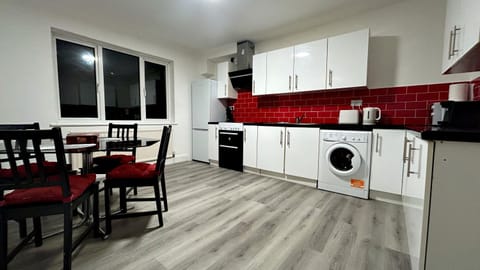 Kitchen or kitchenette, Seating area, Dining area, oven, stove, washing machine