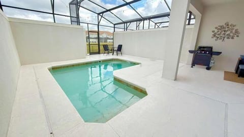 Modern Oasis at Storey Lake w 4BR & Heated Pool House in Kissimmee