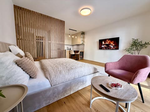 Bed, TV and multimedia, Living room, Seating area