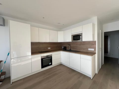 Kitchen or kitchenette, dishwasher, oven, stove, toaster