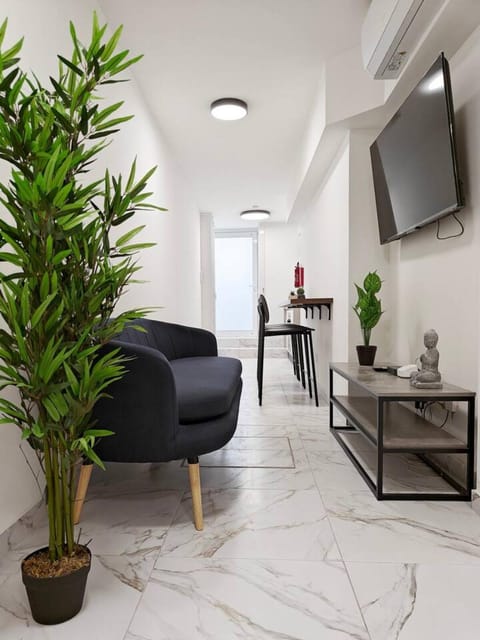 Property building, TV and multimedia, Living room, Seating area, Dining area, air conditioner