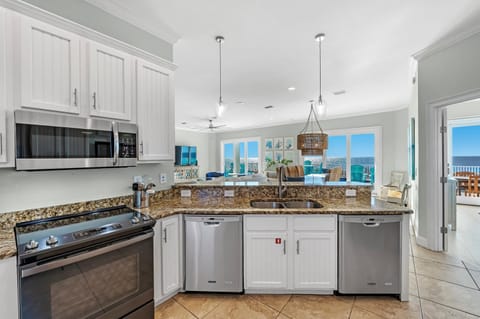 Kitchen or kitchenette, dishwasher, oven, stove