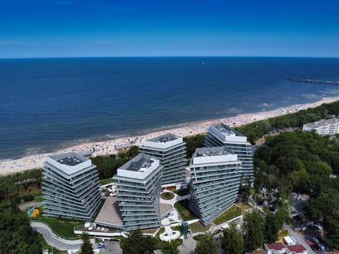 Property building, Restaurant/places to eat, Off site, Day, Natural landscape, Activities, Activities, Bird's eye view, Summer, Beach, On site, City view, Sea view, Time of day, Location, air conditioner