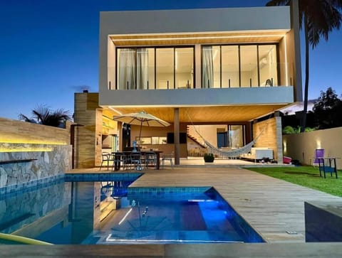 Property building, Patio, Night, Pool view, Swimming pool, sunbed