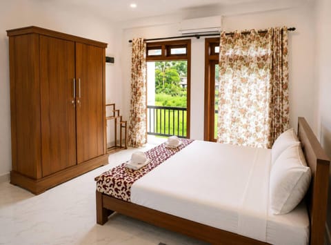 Bed, Photo of the whole room, Bedroom, hair dryier, towels, wardrobe, air conditioner