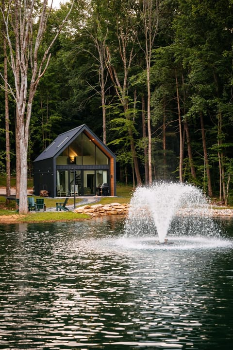 Property building, Patio, Facade/entrance, Natural landscape, Garden, View (from property/room), Lake view