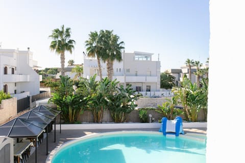 Property building, Patio, Day, Natural landscape, View (from property/room), Pool view, Swimming pool, sunbed