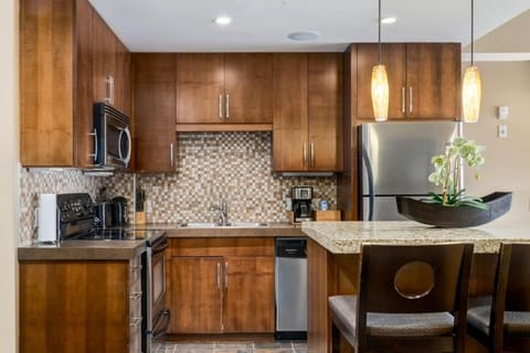 Kitchen or kitchenette, dishwasher, oven, stove, toaster
