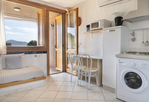 Kitchen or kitchenette, Living room, Dining area, stove, washing machine