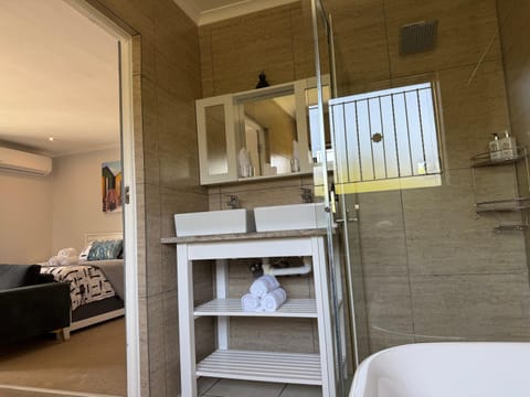 Shower, Bed, Bathroom, Photo of the whole room, Bedroom, towels, air conditioner
