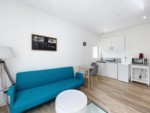 Living room, Seating area, washing machine, kitchen