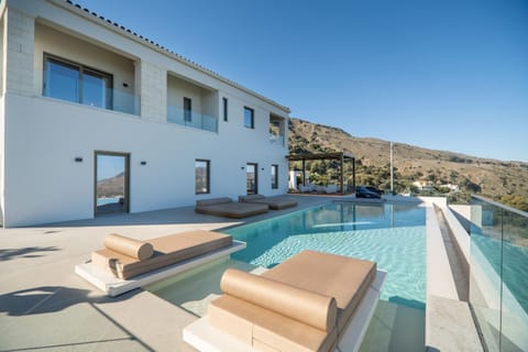 Property building, Natural landscape, Swimming pool, sunbed
