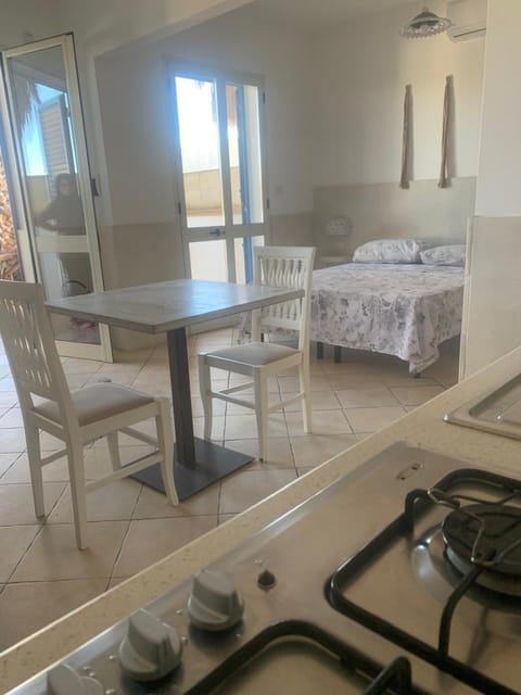 Bed, Photo of the whole room, Dining area, stove, air conditioner