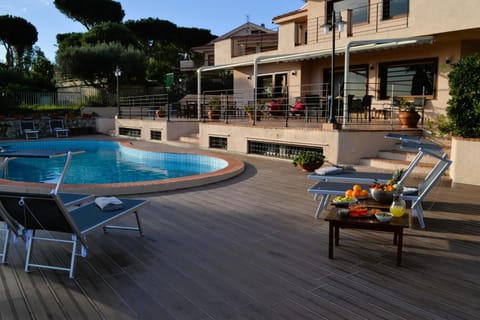 Property building, Patio, Swimming pool, sunbed