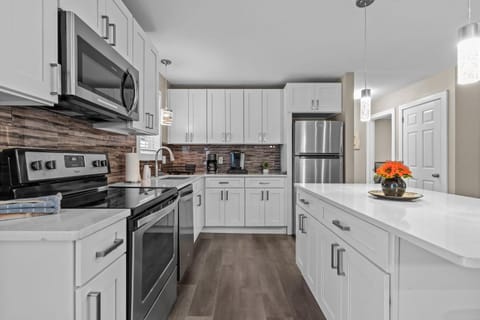 Kitchen or kitchenette, dishwasher, oven, stove